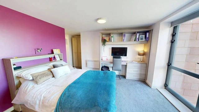 Bed desk shelves and monitor bedroom at Unity Square in Liverpool Student Accommodation