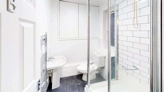 Sink toilet shower with white tile bathroom at Park Village in Sheffield Student Accommodation