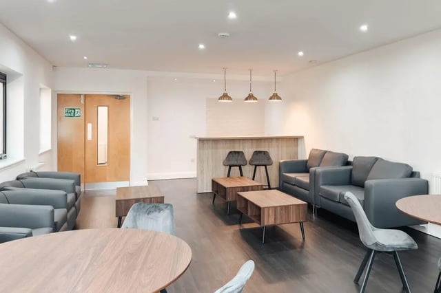 Sofa tables chairs bar and doors communal area at Park Village in Sheffield Student Accommodation