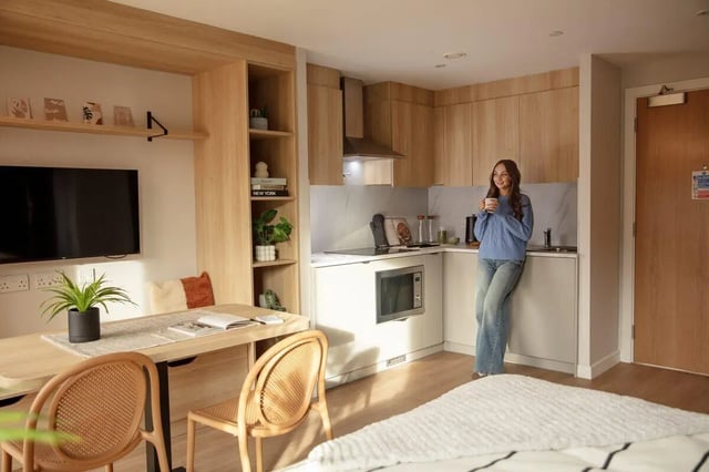 Kitchen area with dining table and bed area at Fusion Students Liverpool in Liverpool Student Accommodation