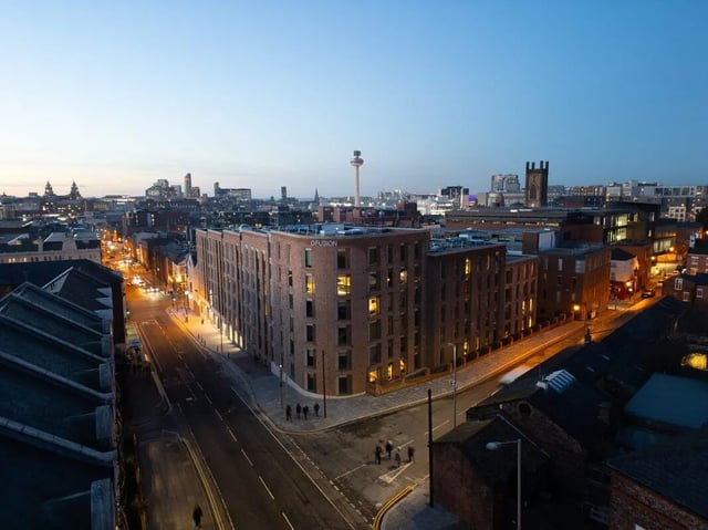 Brick student accommodation building exterior at dusk at Fusion Students Liverpool in Liverpool Student Accommodation
