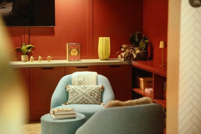 Blue armchairs with decorative pillows and books living room at Fusion Students Liverpool in Liverpool Student Accommodation