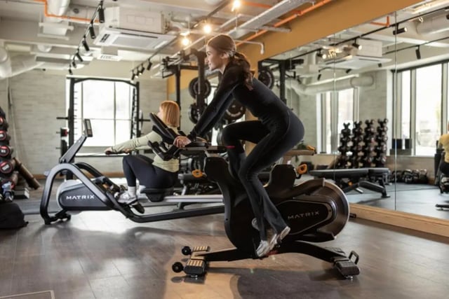 Two women exercising on stationary bikes gym at Fusion Students York in York Student Accommodation