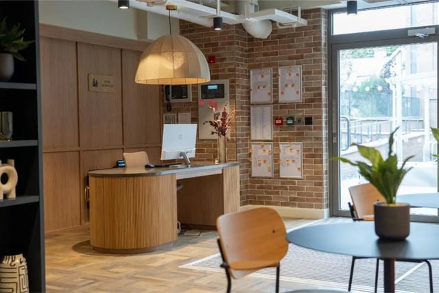 Reception desk with computer and chairs reception area at Fusion Students York in York Student Accommodation