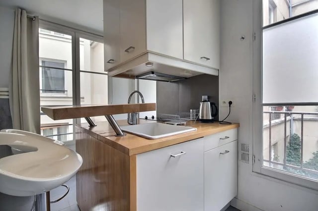 Kitchen with sink kettle and counter kitchen at Apartment in Rue Keller, 75011 Paris, France in Paris Student Accommodation