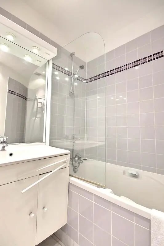 Sink vanity bathtub shower screen glass Bathroom at Apartment in Rue Caulaincourt, 75018 Paris, France in Paris Student Accommodation