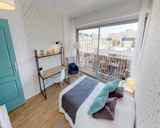 Bed desk chair and balcony bedroom at Room in 33 Rue d'Hautpoul, 75019 Paris, France in Paris Student Accommodation