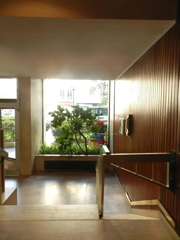 Interior entryway with planter and wooden walls exterior at Studio in Rue Lecourbe, 75015 Paris, France in Paris Student Accommodation