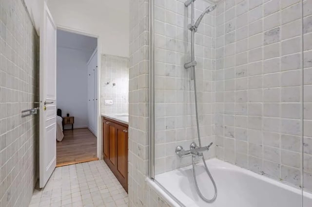 Shower bathtub vanity and open doorway bathroom at Apartment in 2 Rue de Miromesnil, 75008 Paris, France in Paris Student Accommodation