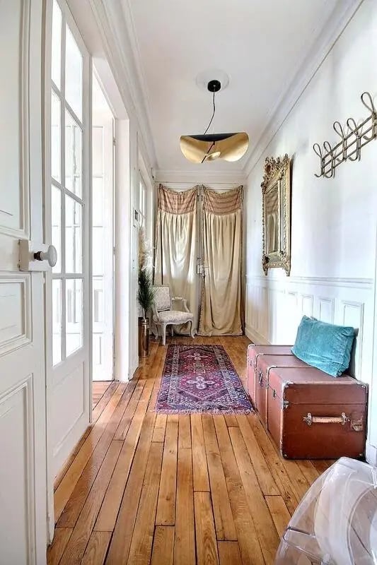 Hallway with rug chair trunks mirror hallway at Apartment in Rue Régis, 75006 Paris, France in Paris Student Accommodation