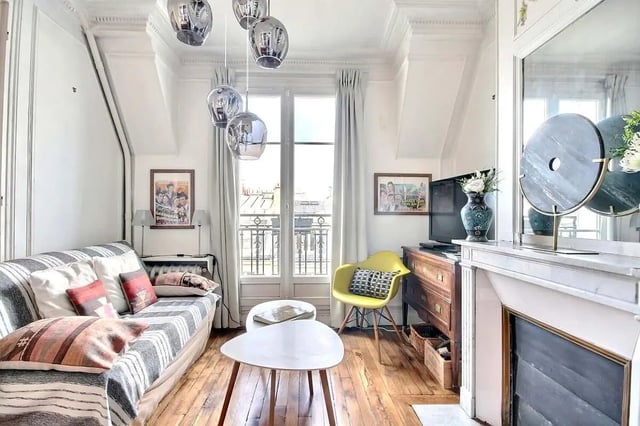 Sofa yellow chair modern lights living room at Apartment in Rue Régis, 75006 Paris, France in Paris Student Accommodation