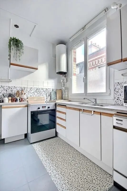 White cabinets oven sink and window kitchen at Apartment in Rue Régis, 75006 Paris, France in Paris Student Accommodation