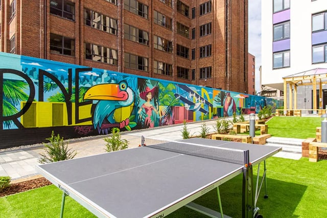 Ping pong table and colorful mural exterior playing area at Skyline in Bournemouth Student Accommodation