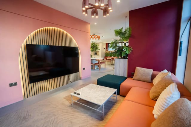 Modern living area with sectional couch coffee table living room at Skyline in Bournemouth Student Accommodation