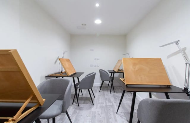 Drawing desks with lamps and chairs study area at Skyline in Bournemouth Student Accommodation