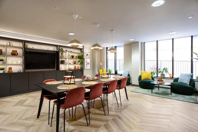 Dining table red chairs shelving unit living area at Burnsall House in Coventry Student Accommodation