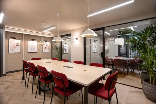 Long table red chairs artwork group study area at Burnsall House in Coventry Student Accommodation
