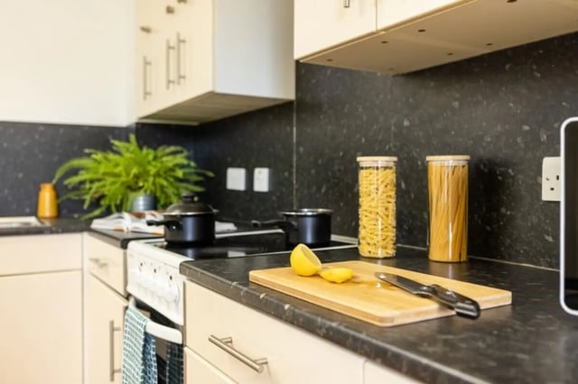 Counter with pasta jars pots lemon cutting board kitchen at Cranborne House in Bournemouth Student Accommodation