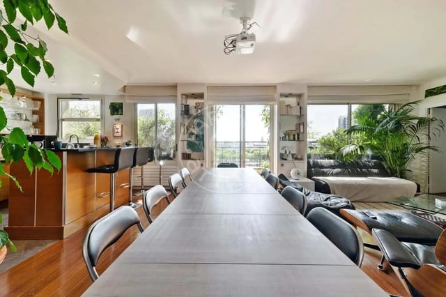 Dining table chairs bar stools kitchen living room at Apartment in Quai Louis Blériot, 75016 Paris, France in Paris Student Accommodation