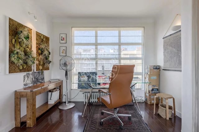 Desk, chair, fan, artwork, window, study area at Apartment in Quai Louis Blériot, 75016 Paris, France in Paris Student Accommodation