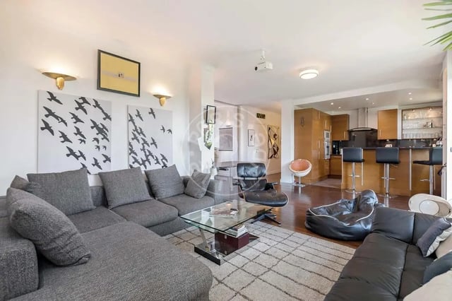 Sectional sofa glass table modern chairs kitchen living room at Apartment in Quai Louis Blériot, 75016 Paris, France in Paris Student Accommodation