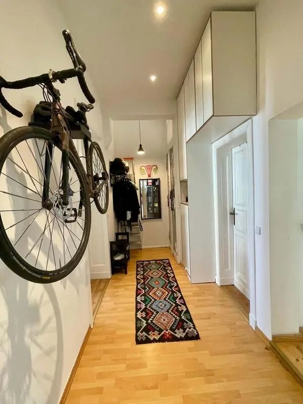 Bike on wall colorful rug hallway Interior at Apartment in Wallstraße, Berlin for 100 m² in Berlin Student Accommodation