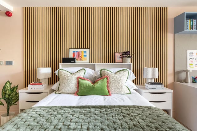 Bed with decorative pillows and nightstands bedroom at Hamilton House in Brighton Student Accommodation