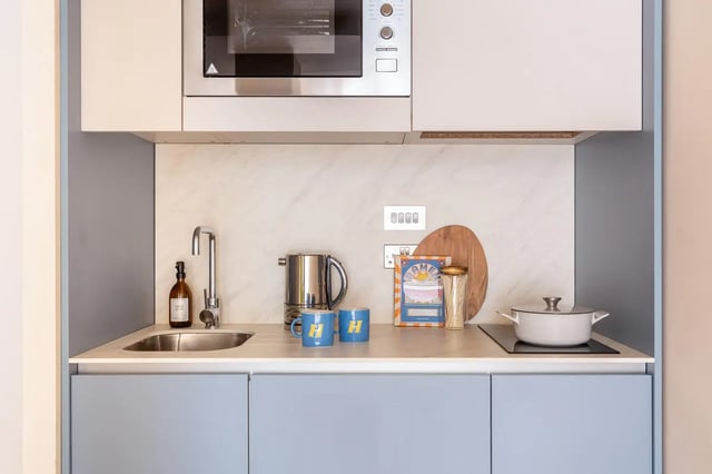 Sink kettle mugs and pot kitchen area at Hamilton House in Brighton Student Accommodation
