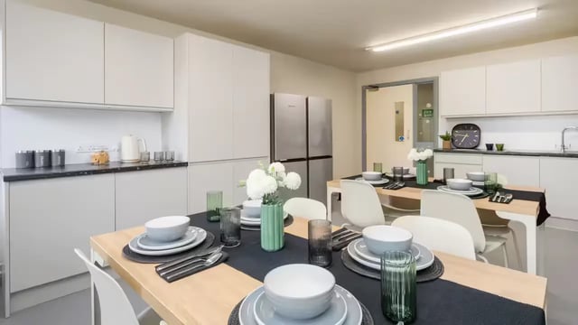 Dining tables set with place settings kitchen exterior at Hardwick Campus in Cheltenham Student Accommodation