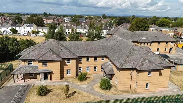 Brick student accommodation building with courtyard exterior at Hardwick Campus in Cheltenham Student Accommodation