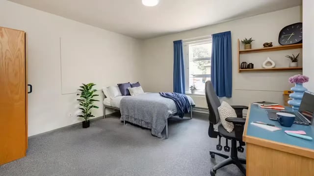 Bed desk chair plant clock bedroom at Hardwick Campus in Cheltenham Student Accommodation