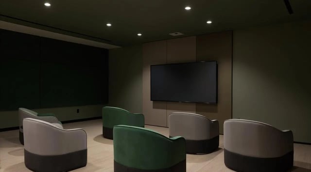 Chairs and large screen TV in common area living room at Studeo by UniLodge in Melbourne Student Accommodation
