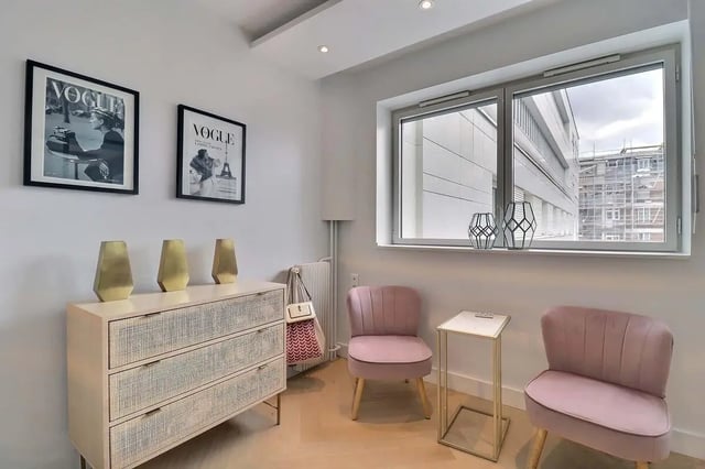 Vase decorated dresser pink chairs and table Living room at Apartment in Pass. du Guesclin, 75015 Paris, France in Paris Student Accommodation