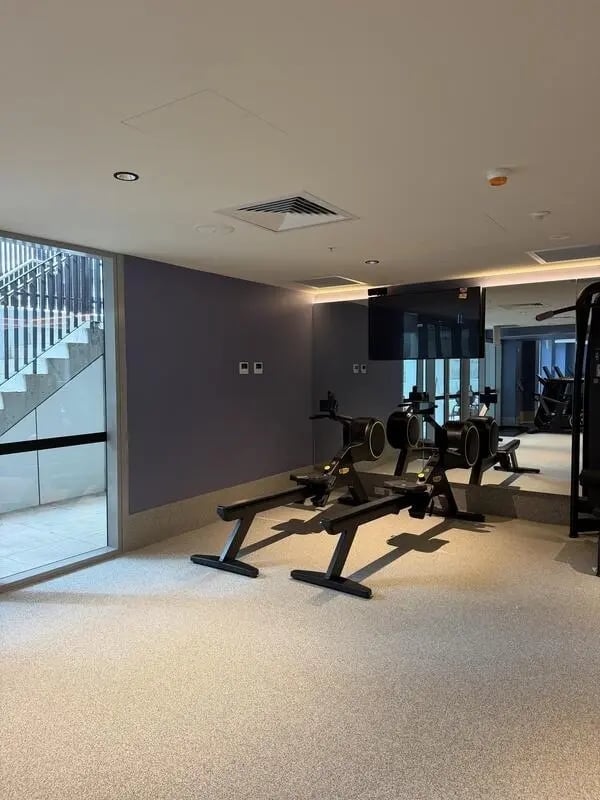 Rowing machines and stairs gym area at The Switch Lachlan Macquarie Park in Sydney Student Accommodation