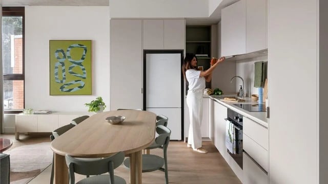 Modern kitchen with dining table and abstract art kitchen at Assemble Swiftwalk in Melbourne Student Accommodation