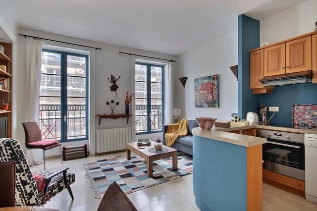 Sofa kitchen table chairs and rug living room at Apartment in Rue Bergère, 75009 Paris, France in Paris Student Accommodation