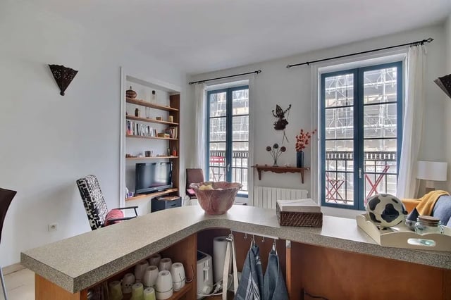 Counter with mugs and kitchen appliances living room at Apartment in Rue Bergère, 75009 Paris, France in Paris Student Accommodation