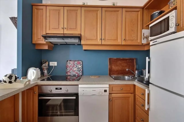 Kitchen with oven dishwasher sink and fridge kitchen at Apartment in Rue Bergère, 75009 Paris, France in Paris Student Accommodation