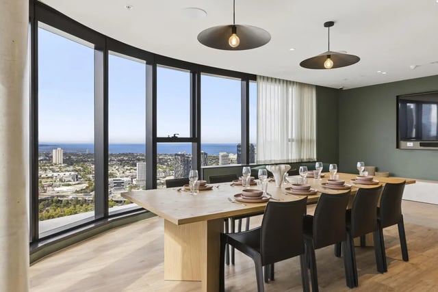Dining table with place settings and city view dining room at West Tower, Melbourne Quarter in Melbourne Student Accommodation