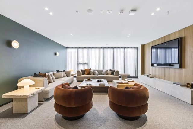 Two brown chairs sofas coffee table living room at West Tower, Melbourne Quarter in Melbourne Student Accommodation