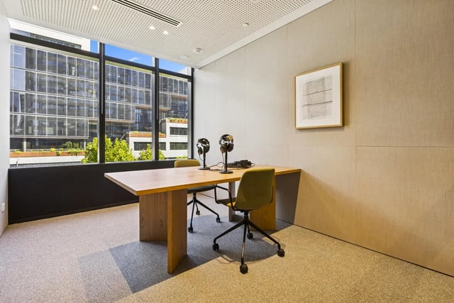 Table with chairs and headphones study area at West Tower, Melbourne Quarter in Melbourne Student Accommodation