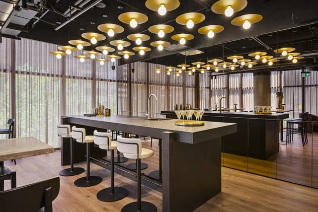 Modern kitchen island with bar stools and glassware kitchen at West Tower, Melbourne Quarter in Melbourne Student Accommodation
