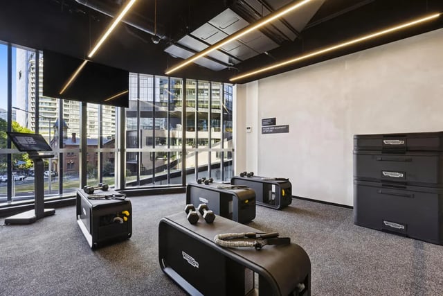 Dumbbells workout machines and storage gym area at West Tower, Melbourne Quarter in Melbourne Student Accommodation