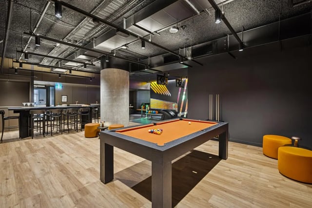 Pool table bar seating and orange stools recreation area at West Tower, Melbourne Quarter in Melbourne Student Accommodation