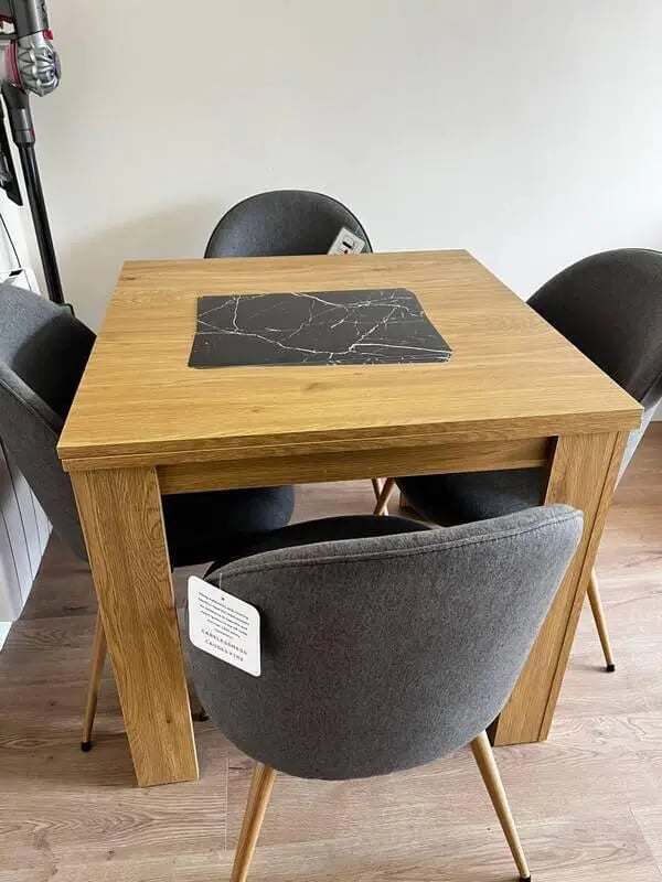 Wooden table with four grey chairs dining area at 16 Emmet Lodge, Emmet Court, Dublin 8 D08 EY83 in Dublin Student Accommodation
