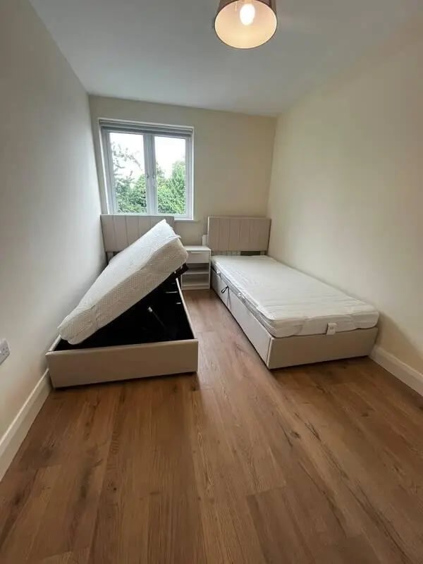 Two beds open storage one with lifted mattress bedroom at 16 Emmet Lodge, Emmet Court, Dublin 8 D08 EY83 in Dublin Student Accommodation