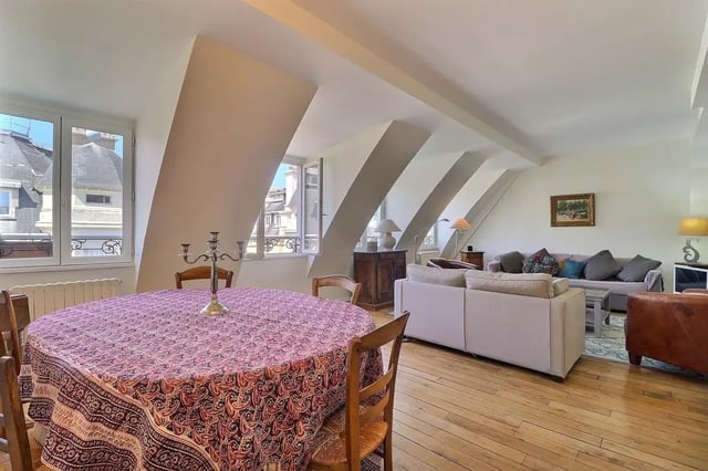 Dining table candelabra then living room at Apartment in Rue César Franck, 75015 Paris, France in Paris Student Accommodation