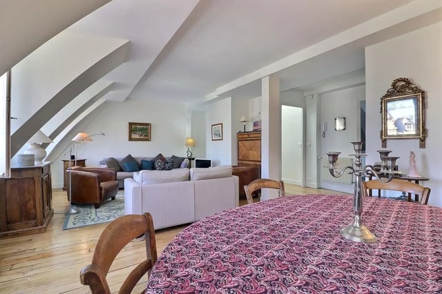 Living room with sofas chairs table and candelabra living room at Apartment in Rue César Franck, 75015 Paris, France in Paris Student Accommodation
