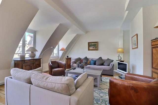 Sofas armchair coffee table TV living room at Apartment in Rue César Franck, 75015 Paris, France in Paris Student Accommodation