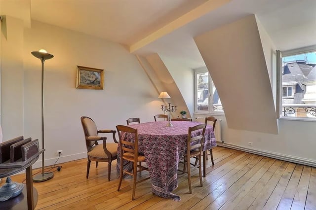 Dining table with chairs lamp and artwork dining room at Apartment in Rue César Franck, 75015 Paris, France in Paris Student Accommodation